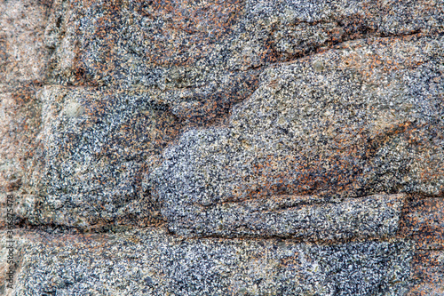 gray stone texture with inclusion and homogeneous background of the rock