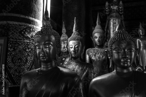 Buddha Statue at Wat Xieng Thong, Buddhist temple of Luang Phrabang, Laos photo