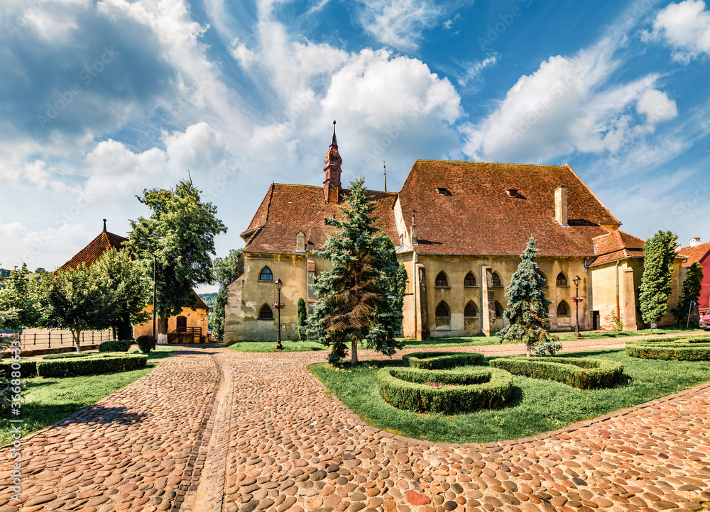 Spectacular morning cityscape of Sighisoara with Evangelical Church on background. Perfect summer view of medieval town of Transylvania, Romania, Europe. Traveling concept background. Spectacular morning cityscape of Sighisoara with Evangelical Church on background. Perfect summer view of medieval town of Transylvania, Romania, Europe. Traveling concept background.