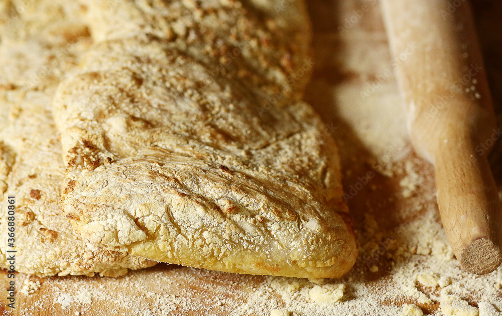 two ciabatta bread loaf fresh bake close up photo on kitchen board