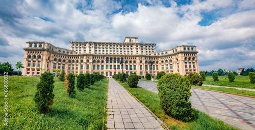 BUCHAREST, ROMANIA - JULY 09, 2018: Colorful summer view of Palace of the Parliament. Bright morning cityscape of Bucharest city - capital of Romania, Europe. Traveling concept background.