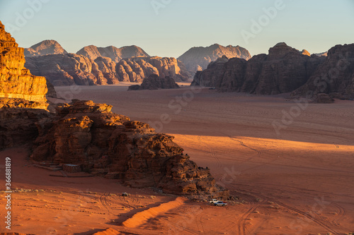 Landscape of mountains and desert in  Wadi Rum desert at beautiful evening sunset in Jordan, Middle east photo