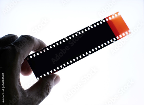 Color negative film 35mm, Photographic film top view in darkroom.