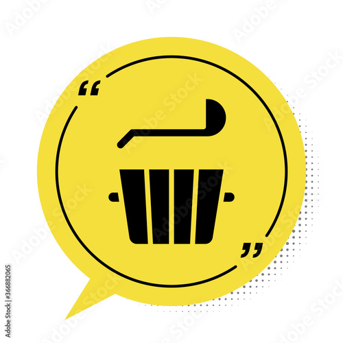 Black Sauna bucket and ladle icon isolated on white background. Yellow speech bubble symbol. Vector.