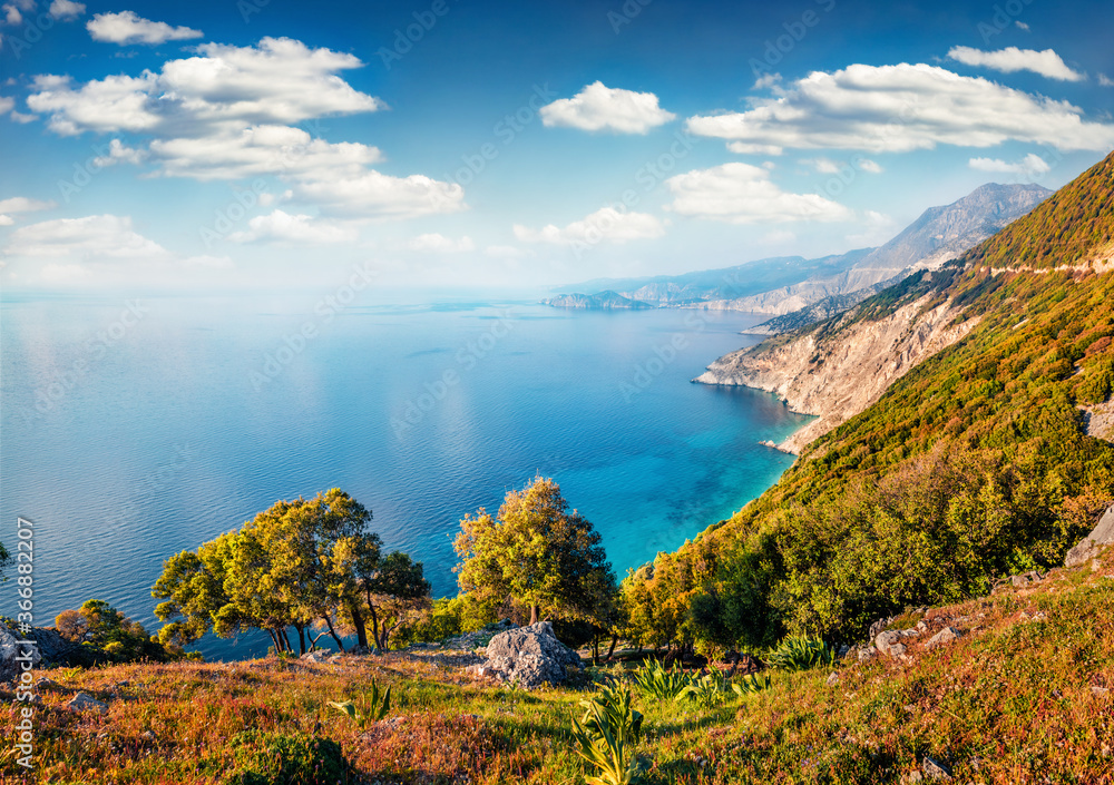 Aerial view of Myrtos bay. Picturesque morning scene of Cephalonia island, Divarata village location, Greece, Europe. Spectacular spring seascape of Ionian Sea. Beauty of nature concept background.