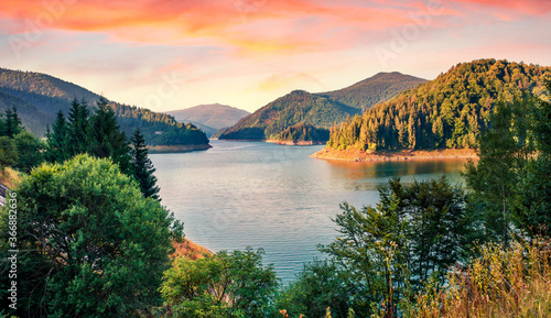 Fotografie Colorful summer sunrise on Dragan lake