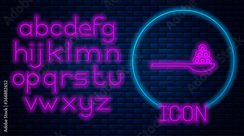 Glowing neon Caviar on a spoon icon isolated on brick wall background. Neon light alphabet. Vector..