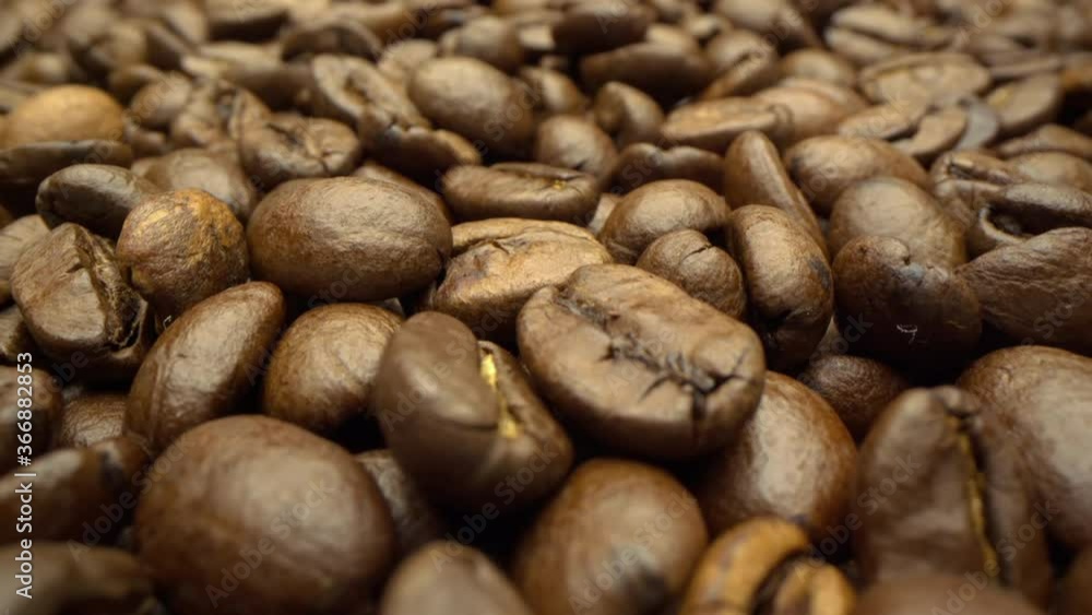 Motorized moving shot of coffee beans, shot with macro probe lens Motorized moving shot of coffee beans, shot with macro probe lens