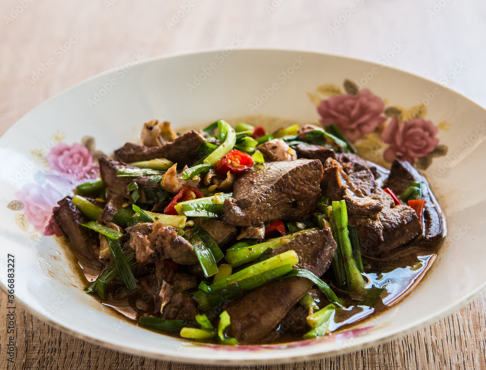 Fried pork liver with Chinese chives , Thai famous  food