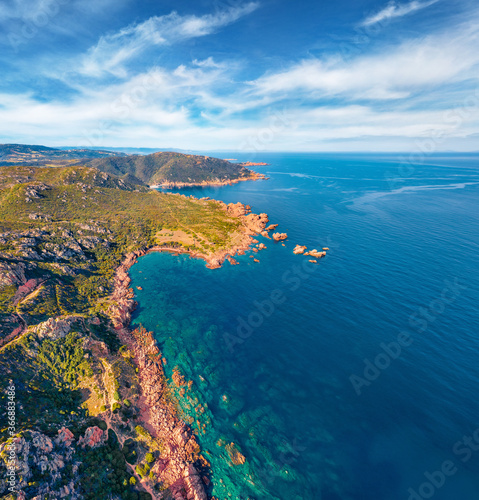 Aerial view from drone of Li Cossi seashore. Colorful spring scene of Costa Paradiso, Sardinia island, Italy, Europe. Captivating Mediterranean seascape. Beauty of nature concept background.
