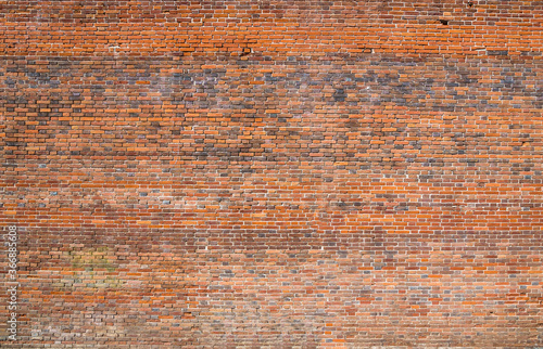 Red brick wall texture grunge background with vignetted corners, may use to interior and exterior design. (ID: 366885608)