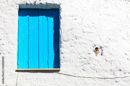 Greek blue window shutters © anetlanda