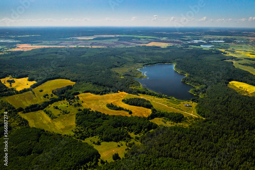 Top view of Bolta lake in the forest in the Braslav lakes National Park at dawn, the most beautiful places in Belarus.An island in the lake.Belarus. photo