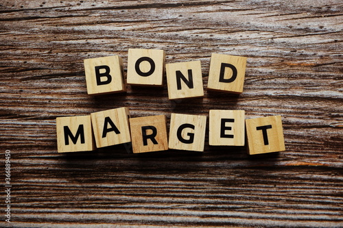 Bond Market alphabet letter on wooden background