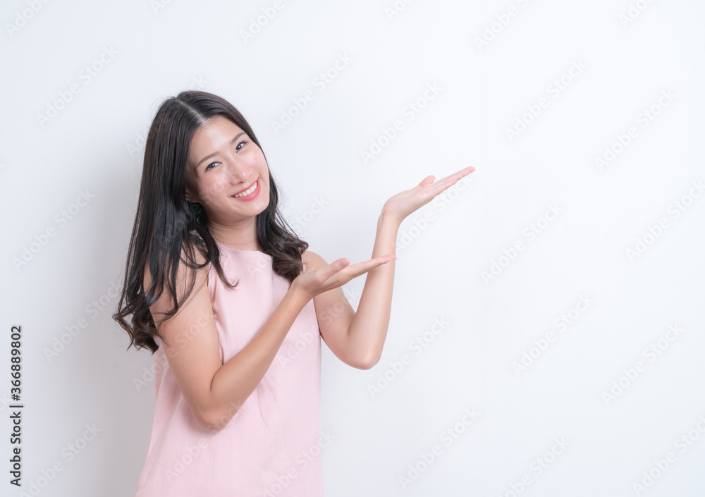 Young asian woman happy smiling in pink dress Young asian woman happy smiling in pink dress