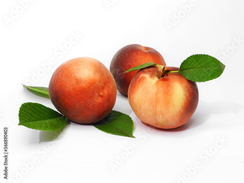 Ripe peaches on white isolated background