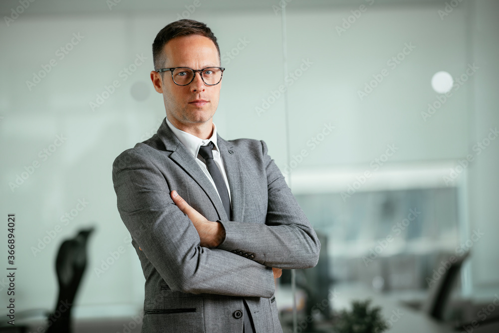 Handsome businessman in office. Young man working in the office. Handsome businessman in office. Young man working in the office.
