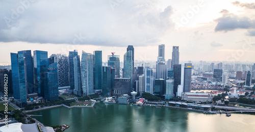 Singapore sunset view panoramic banner. Modern skyscrapers and skyline of business district Marina Bay Sands at developing Asian city. Travel, background, landmark concept
