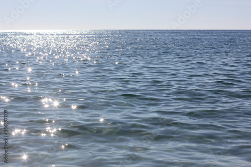 Alanya, TURKEY - August 10, 2013: Travel to Turkey. The pier. Clear blue sky. The waves of the Mediterranean Sea. Water surface. Coast.