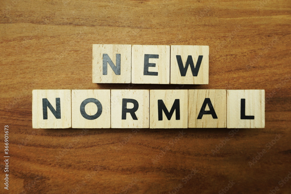 Naklejka premium New Normal alphabet letters on wooden background