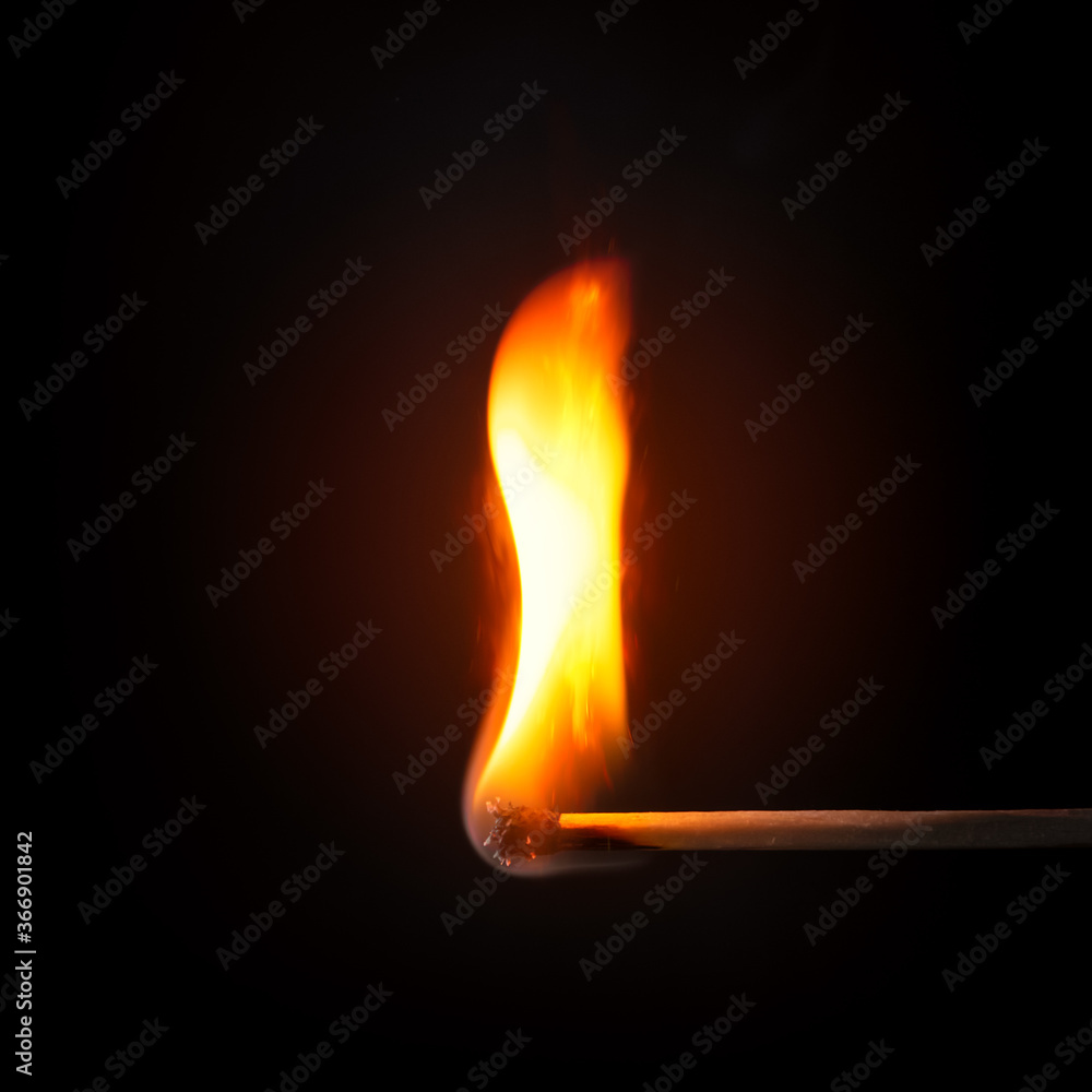 match stick flame in front of a black background match stick flame in front of a black background