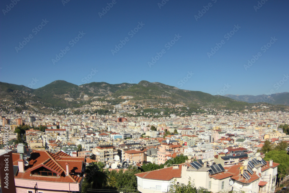 Alanya, TURKEY - August 10, 2013: Travel to Turkey. Greenery. Flowers. Green hills. The mountains. Rocks, wildlife of Turkey. Forest and clear blue sky. The waves of the Mediterranean Sea. Water surfa
