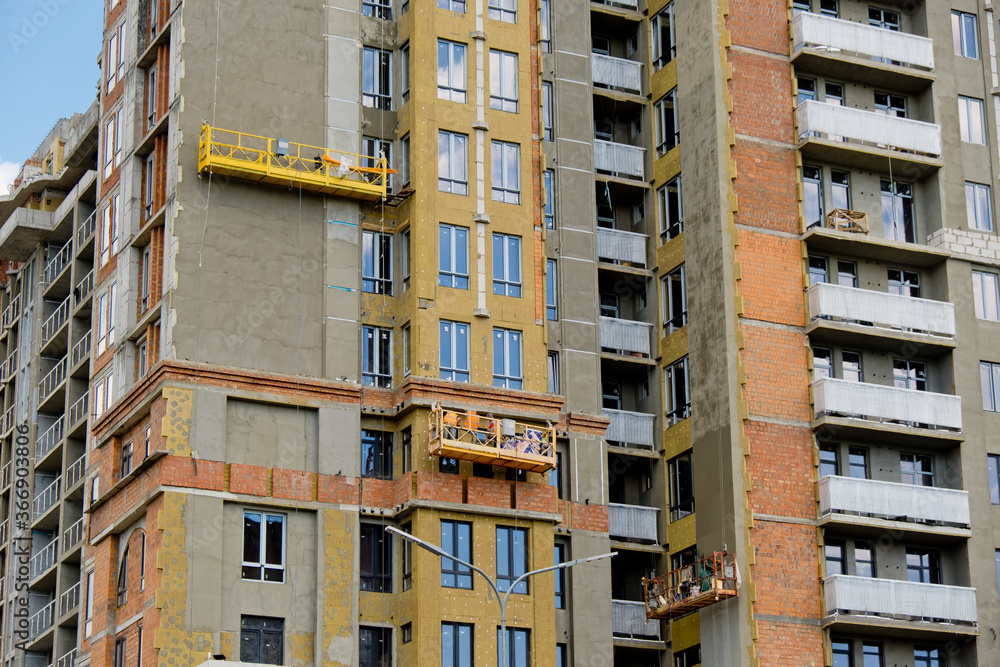 Unfinished new modern high-rise building in the city. Unfinished new modern high-rise building in the city.