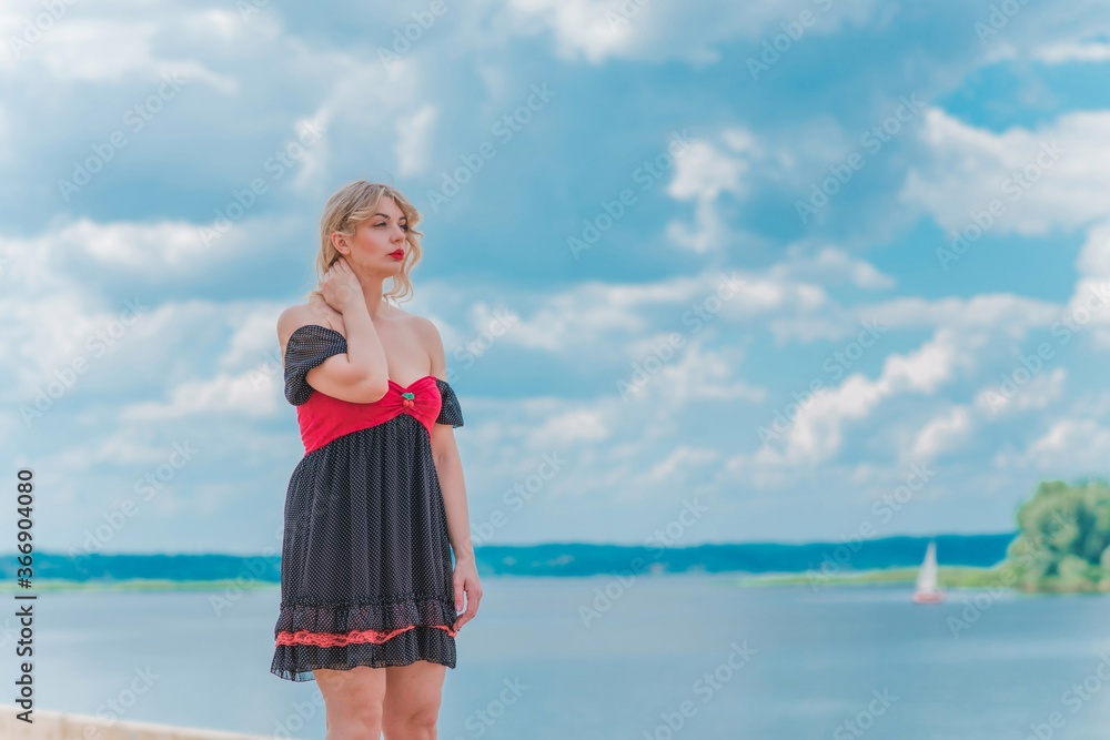 Pretty vintgae style for ladies, retro polka dot dress. Plus size L-Xl size woman at nature, fancy style Pretty vintgae style for ladies, retro polka dot dress. Plus size L-Xl size woman at nature, fancy style