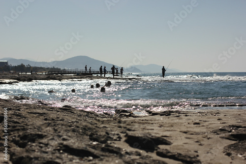 Fototapeta Naklejka Na Ścianę i Meble -  Alanya, TURKEY - August 10, 2013: Travel to Turkey. Beaches on the sea. Waves on the Mediterranean coast.