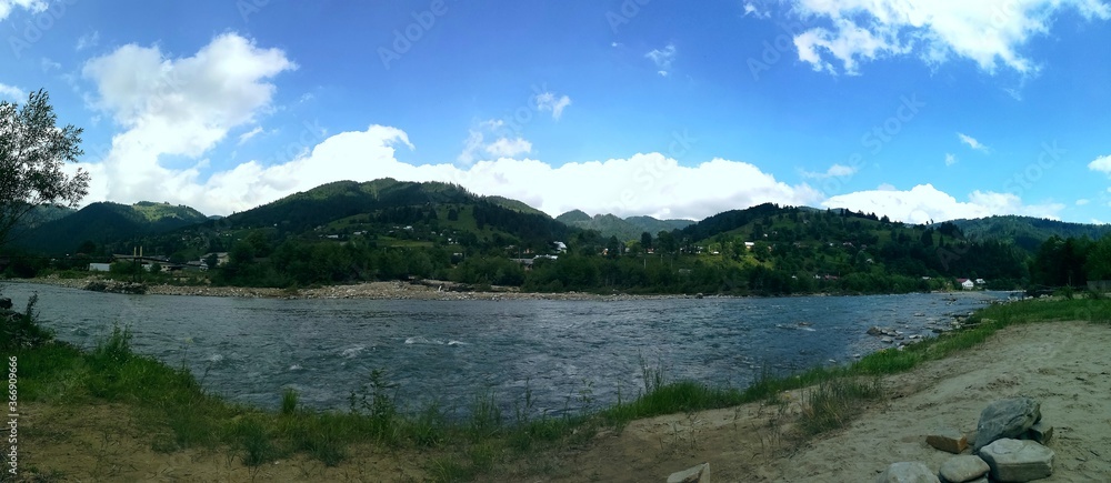 Carpathian mountains and mountain river on a summer day landscape panorama