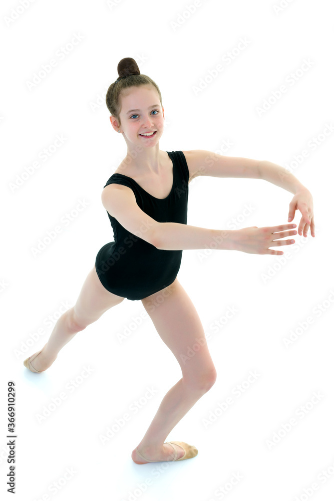 Little girl gymnast in a sports swimsuit. Little girl gymnast in a sports swimsuit.
