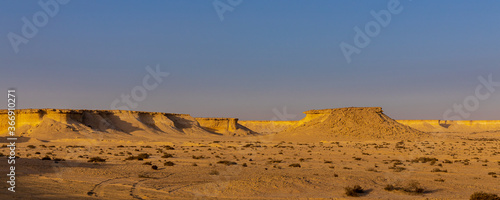 The landscape of the desert in the middle east, formerly being the bottom of the ocean now an arid area with natural resources below or a beautiful place to go on a desert safari 