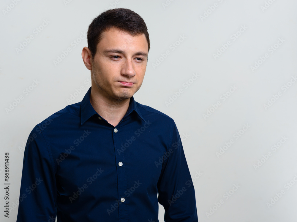 Portrait of handsome businessman against white background Portrait of handsome businessman against white background