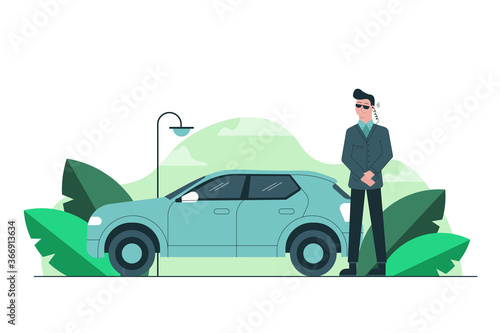 Danger, business, safety, work concept. Young serious focused man guy bodyguard standing standing near car and listening message with security earpiece. Protection celebrities politicians occupation.