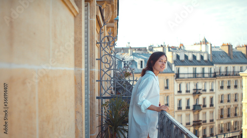 Young woman on a balcony in Paris © AboutLife