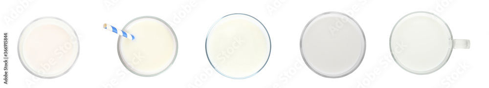 Set with glasses of fresh milk on white background, top view. Banner design Set with glasses of fresh milk on white background, top view. Banner design