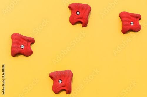 climbing wall at modern gym with colored various hooks