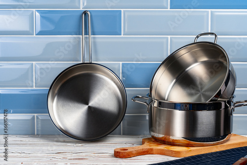 Set of aluminum cookware on kitchen counter