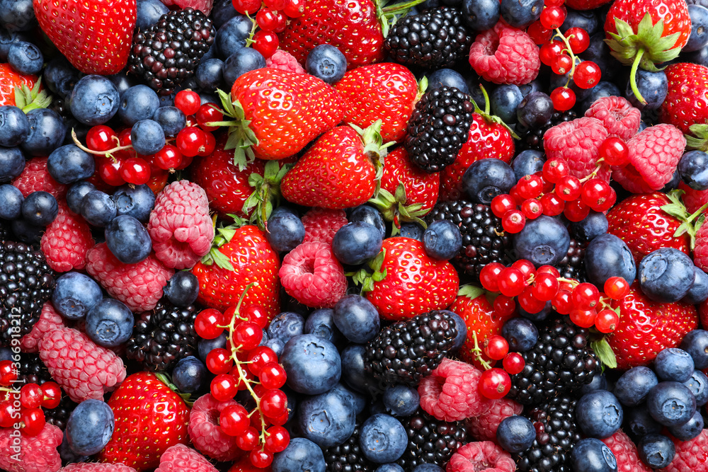 Mix of different ripe tasty berries as background, top view Mix of different ripe tasty berries as background, top view