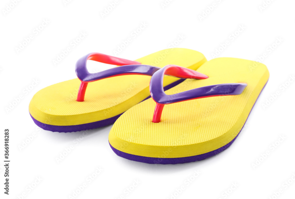Pair of stylish yellow flip flops isolated on white. Beach object Pair of stylish yellow flip flops isolated on white. Beach object