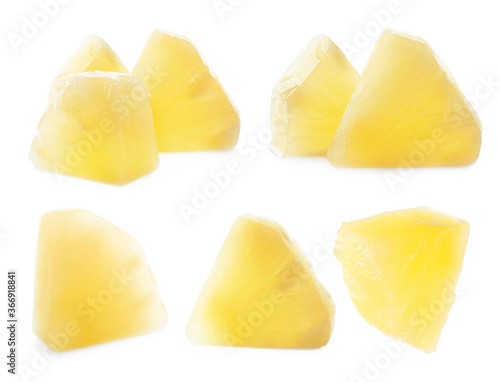 Set of canned pineapple pieces on white background