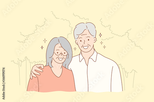 Couple, relationship, embrace, love concept. Old man grandfather and woman grandmother granny senior citizens cartoon characters hugging together and looking at camera. Portrait of elderly pensioners.