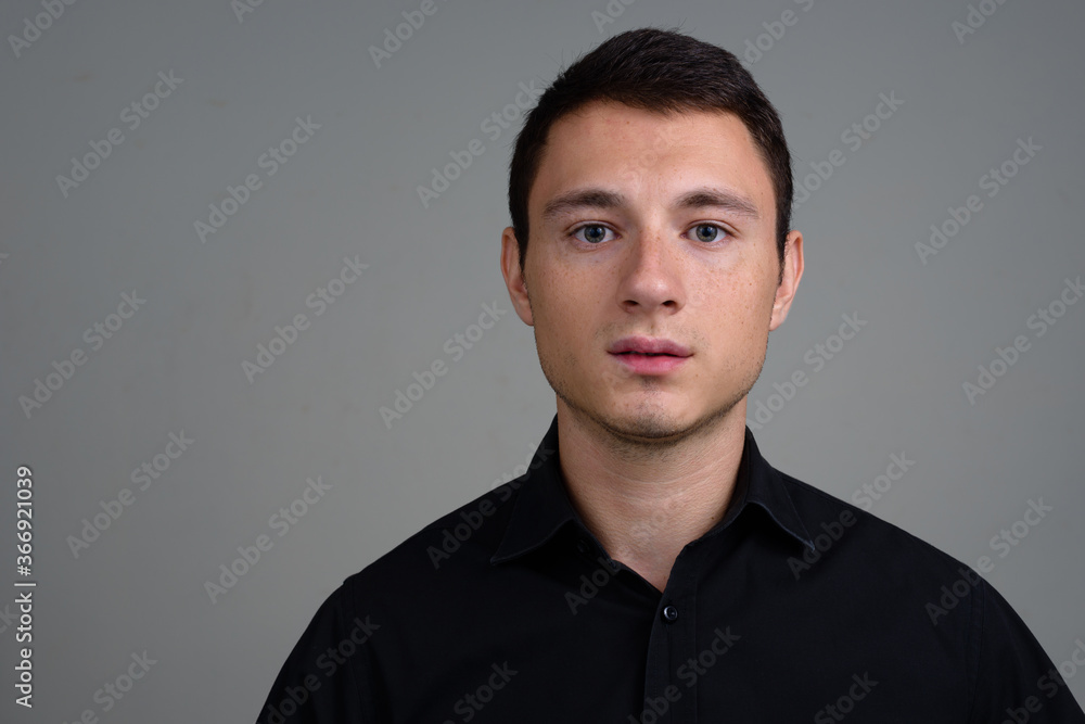 Portrait of handsome businessman against white background Portrait of handsome businessman against white background