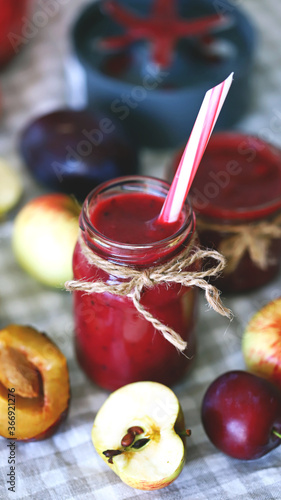 Selective focus. Macro. Plum apple smoothie. Homemade summer fruit smoothies. Detox food.