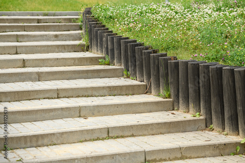 stone steps with a wooden fence in the Park
