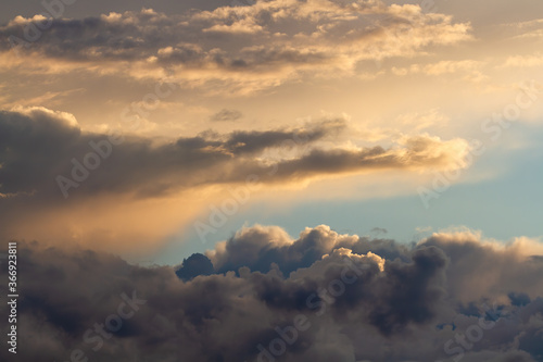 Beautiful cumulus clouds. Sunset. Natural background.