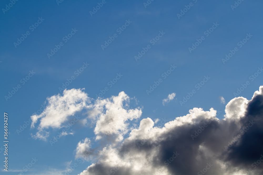 Cumulus clouds. Blue sky. Natural background.