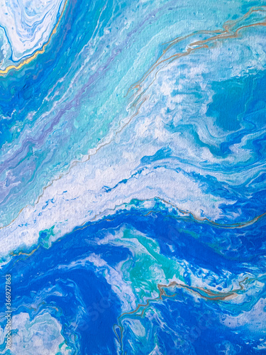 Acrylic paint, smooth stains of blue resin, paints. Marine abstraction from acrylic. Painting, sea wave. Fluid technique.