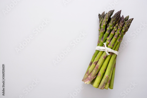 Asparagus heap isolated. Fresh vegetables. Copy space.