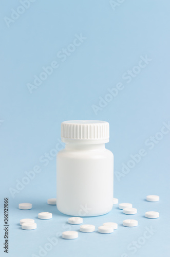 Jar of pills on a blue background. Health. Medicine. Mock-up.